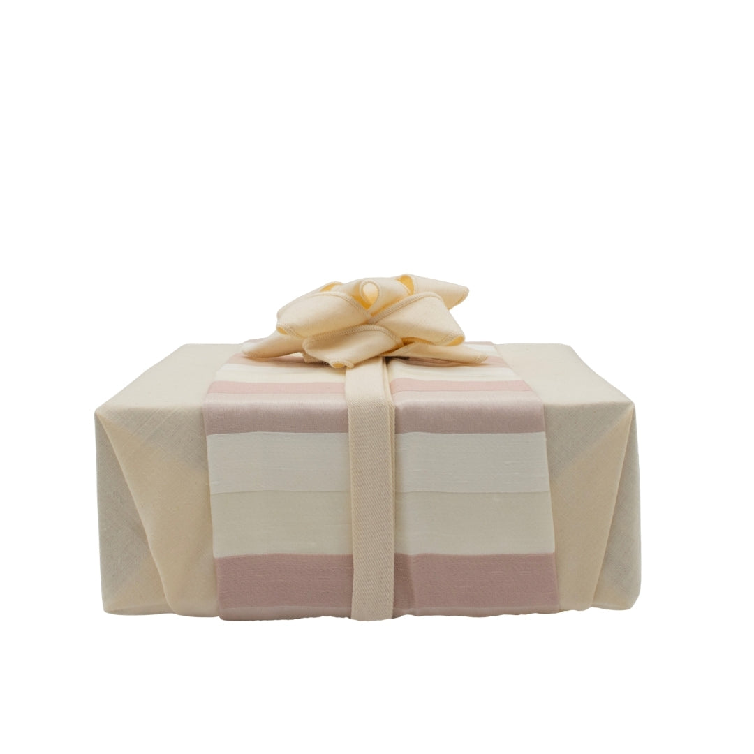 Reusable gift wrapping Vice-Versaᴷᴵᵀ - Multicolored striped band on a light blue Furoshiki and a white bow